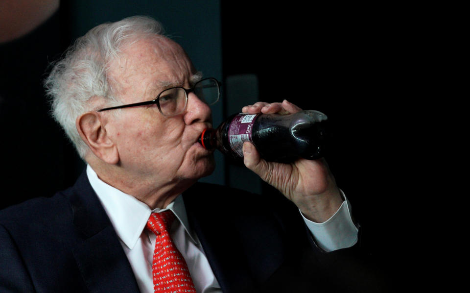 Warren Buffett, CEO of Berkshire Hathaway Inc, takes a drink of Cherry Coke while playing bridge as part of the company annual meeting weekend in Omaha, Nebraska U.S. May 6, 2018. REUTERS/Rick Wilking