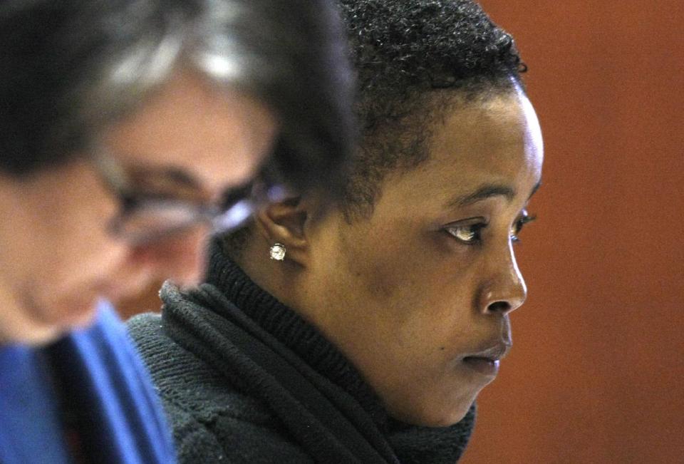 Defense attorney Susan Freedman, left, stands with her client Haniyyah Barnes Tuesday, April 29, 2014, in Newark, N.J. has admitted killing her neighbor's small dog by throwing it into traffic during an argument over a parking space. The Star-Ledger of Newark reports that Barnes pleaded guilty Tuesday to breaking into her neighbor's home, grabbing the 2-year-old Shih Tzu named Honey Bey and throwing the dog into oncoming traffic in August 2011, where she was struck by a vehicle and killed. Barnes will be sentenced on July 14. (AP Photo/The Star-Ledger, Patti Sapone, Pool)