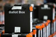 Sealed ballot boxes containing voting slips wait to be processed in north London on May 6, 2016