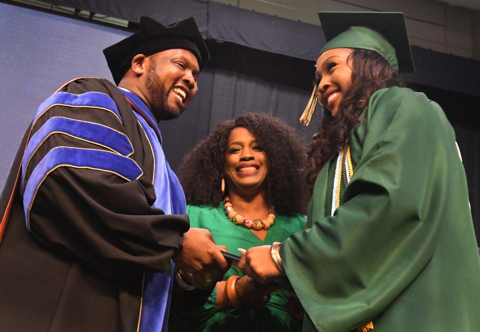 Caddo Parish Superintendent Dr. Lamar Goree with his wife Kimberly present their daughter Madison her diploma at the Captain Shreve High School class of 2023 Commencement Exercises.