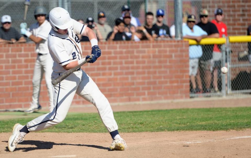 Central Catholic’s Seth Van Dyk makes contact with a pitch during Game 1 of the CIF Sac-Joaquin Section D-III semifinals against Oakdale at Oakdale High School on Monday, May 13, 2024. Central Catholic took a 1-0 series lead with an 8-1 win.
