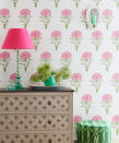 <p> Three diverse patterns &#x2013; a perky floral wallpaper, a modern African print upholstered pouffe and a classic trellis design on the front of a classic chest of drawers &#x2013; have been cleverly layered to work together harmoniously.&#xA0; </p> <p> This is a perfect example of modern country. Many of the elements in isolation could be seen a quite country, but somehow the combination adds up to a thoroughly modern look. Fresh, clean, upbeat and very characterful. We also love the touch of flouro brought in with the shade and lamp, a clever resin version of a classic turned wood lampstand. </p>