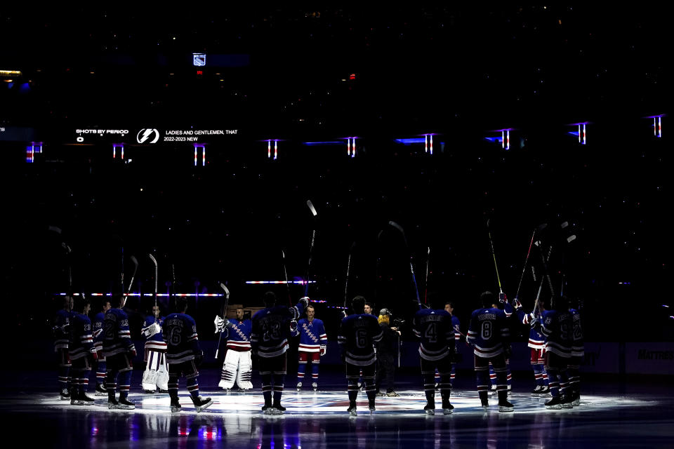 The New York Rangers players are introduced before an NHL hockey game against the Tampa Bay Lightning, Tuesday, Oct. 11, 2022, in New York. (AP Photo/Julia Nikhinson)