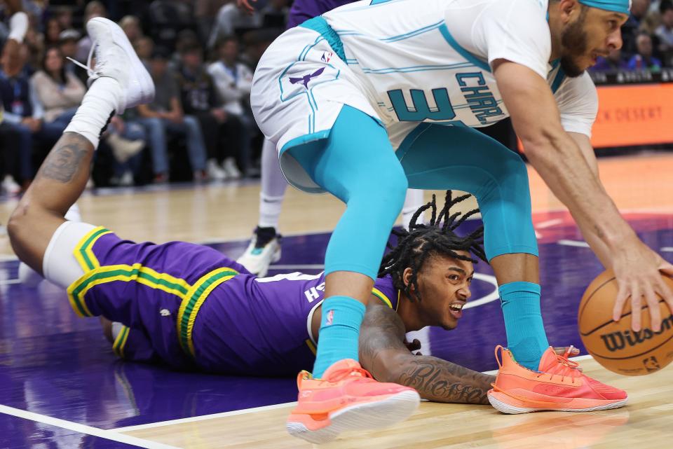 Utah Jazz forward Brice Sensabaugh (8) competes for the loose ball with Charlotte Hornets guard Seth Curry (30) in Salt Lake City on Thursday, Feb. 22, 2024. | Jeffrey D. Allred, Deseret News