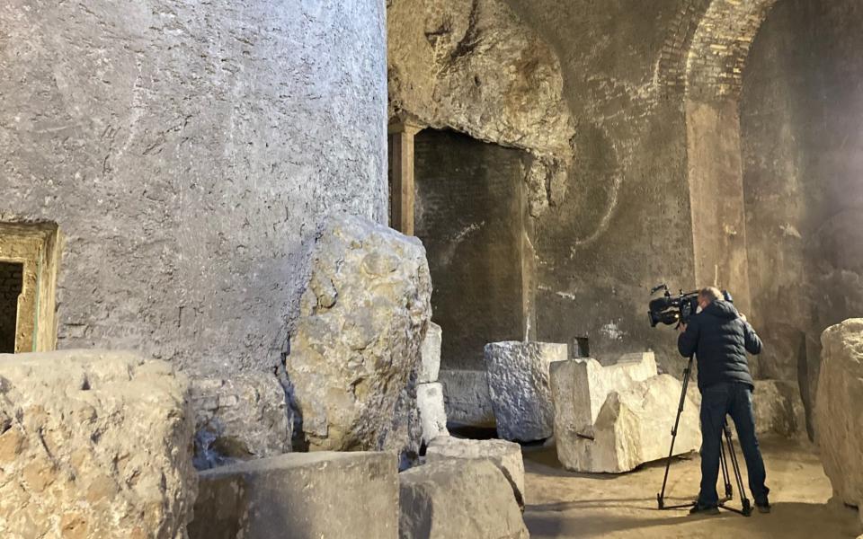 A TV cameraman films the inner sanctum of the mausoleum - Nick Squires