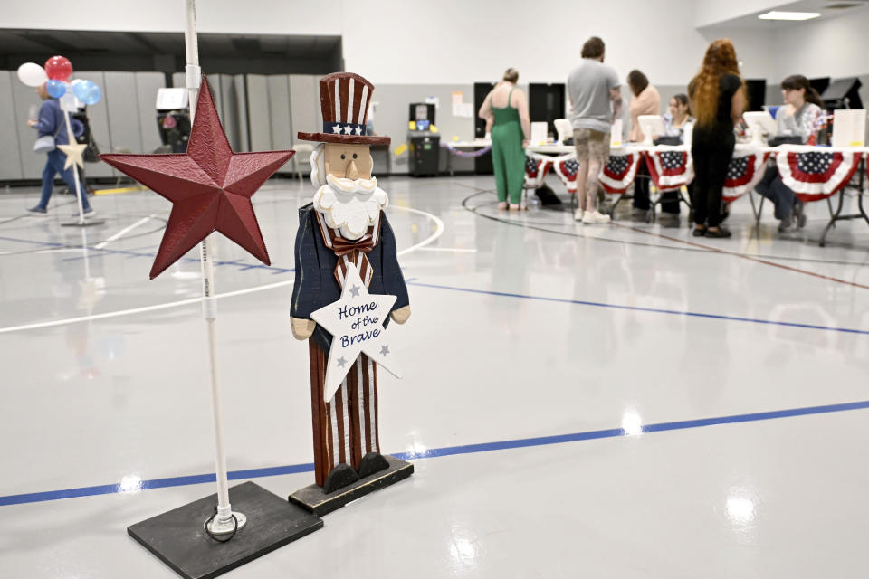 Voters check in to cast their ballot at Elmdale Baptist Church Tuesday March 5, 2024, in Springdale, Ark. Super Tuesday elections are being held in 16 states and one territory. Hundreds of delegates are at stake, the biggest haul for either party on a single day. (AP Photo/Michael Woods)