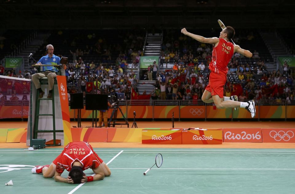 <p>Fu Haifeng (CHN) of China and Zhang Nan (CHN) of China celebrate after winning their match against V Shem Goh (MAS) of Malaysia and Wee Kiong Tan (MAS) of Malaysia. (Reuters) </p>