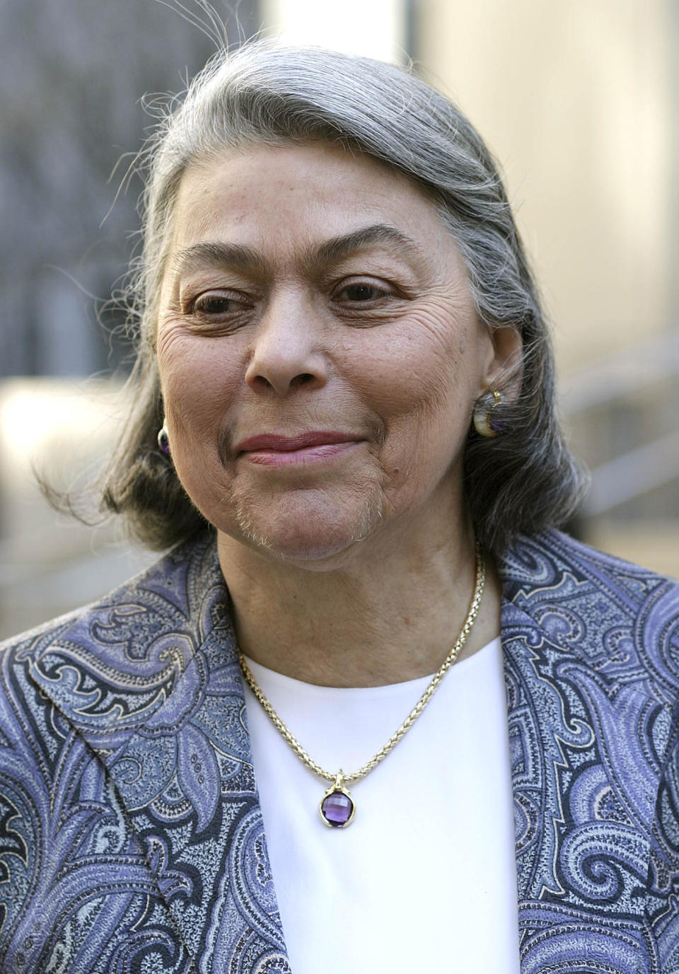 FILE- In this Feb. 10, 2004, file photo, Judge Miriam Goldman Cedarbaum arrives at U.S. District court in New York to take the bench in the Martha Stewart trial. Unlike most people their age, New York City’s federal judges prefer to strike one topic from the record: retirement. The federal judicial system has become a case study in how the country will cope in coming decades with a graying America, where each economic crisis increases the likelihood that more people must work beyond 65. (AP Photo/John Marshall Mantel, File)