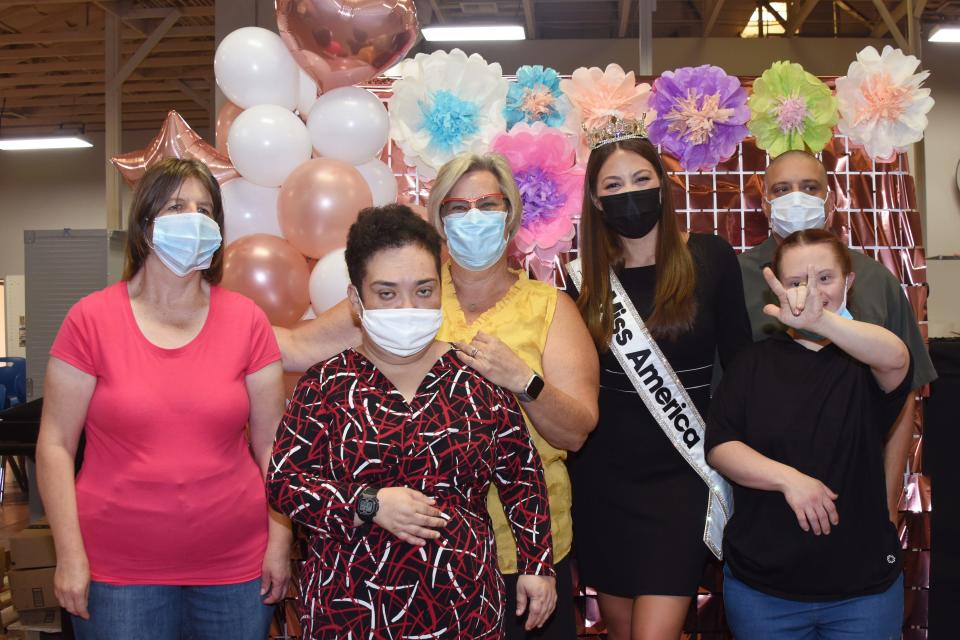 Members of the Desert Arc Yucca Valley Team (left to right) Christian B., Paula H., Dianna Anderson, Asst. Dir. of Desert Arc's Yucca Valley Operations, Miss America 2022 Emma Broyles, Kristin B., and Brandon A.