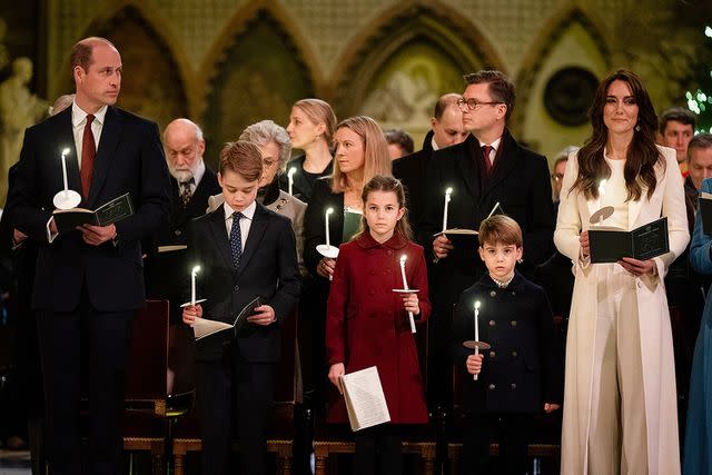 <p>Aaron Chown - WPA Pool/Getty </p> The Prince and Princess of Wales attended the carol concert with their three children on Friday