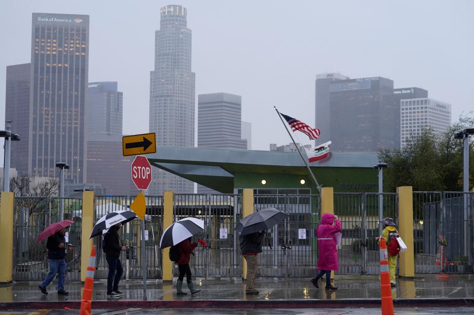 Los Angeles Unified School District, LAUSD teachers and Service Employees International Union 99 (SEIU) members strike during heavy rain outside the Edward R. Roybal Learning Center in Los Angeles Tuesday, March 21, 2023.  Tens of thousands of workers in the Los Angeles Unified School District walked off the job Tuesday over stalled contract talks, and they were joined by (AP)