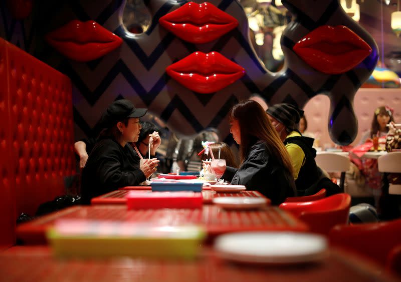Guests enjoy drinks and food at Kawaii Monster Cafe amid the coronavirus disease (COVID-19) outbreak, in Tokyo