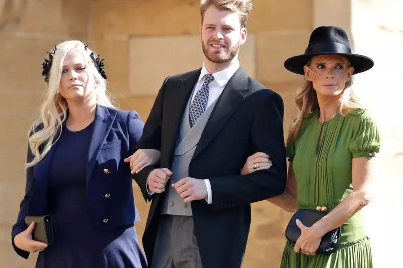 Louis Spencer with his mum Victoria and sister Eliza at Prince Harry's wedding in 2018