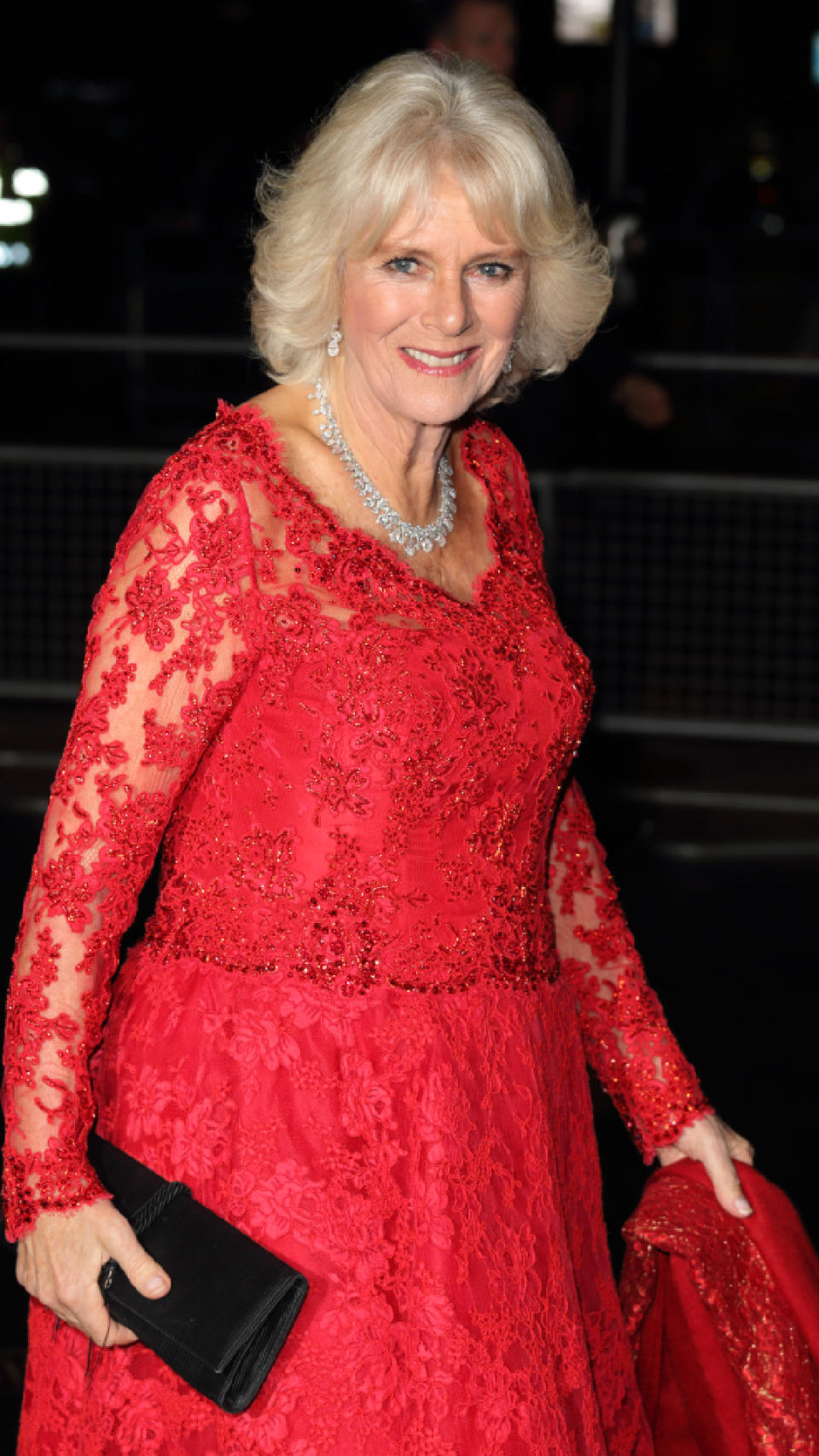 <p> Duchess of Cornwall attended the Annual Royal Variety Performance in a vibrant red dress. A fan of opulent fabric, this full lace gown makes for a glamorous choice for this special event, which the former Duchess of Cornwall attended alongside husband King Charles in a smart suit. </p>