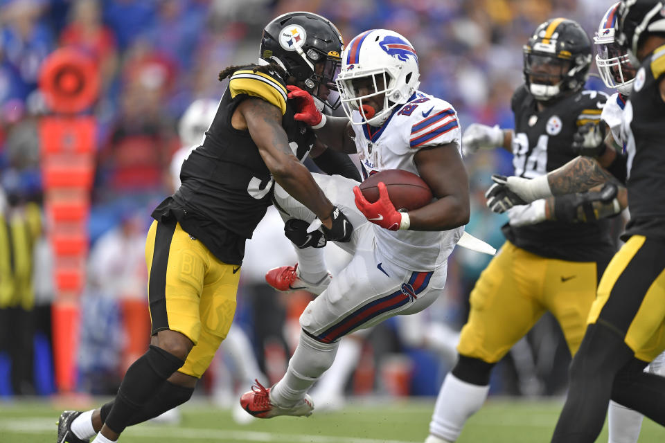 Buffalo Bills running back Devin Singletary (26) is tackled by Pittsburgh Steelers strong safety Terrell Edmunds, left, during the second half of an NFL football game in Orchard Park, N.Y., Sunday, Sept. 12, 2021. The Steelers won 23-16. (AP Photo/Adrian Kraus)