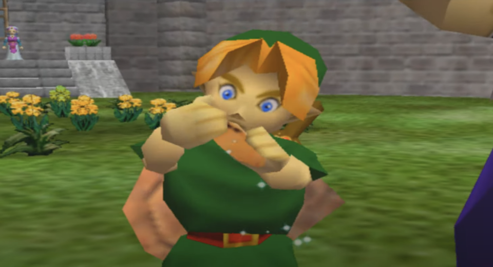 Young Link in Ocarina of Time holding the Ocarina in wonder