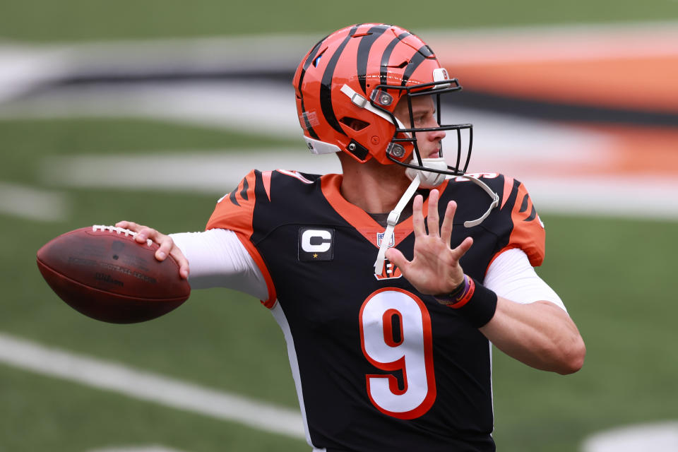 CINCINNATI, OHIO - SEPTEMBER 13: Quarterback Joe Burrow #9 of the Cincinnati Bengals throws a pass as he warms up before playing against the Los Angeles Chargers at Paul Brown Stadium on September 13, 2020 in Cincinnati, Ohio.  (Photo by Bobby Ellis/Getty Images)