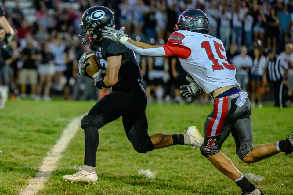 Centralia's Jesse Caballero (37) breaks away from Clark County's Austin Day (15) during a game at Centralia High School on Sept. 29, 2023, in Centralia, Mo.