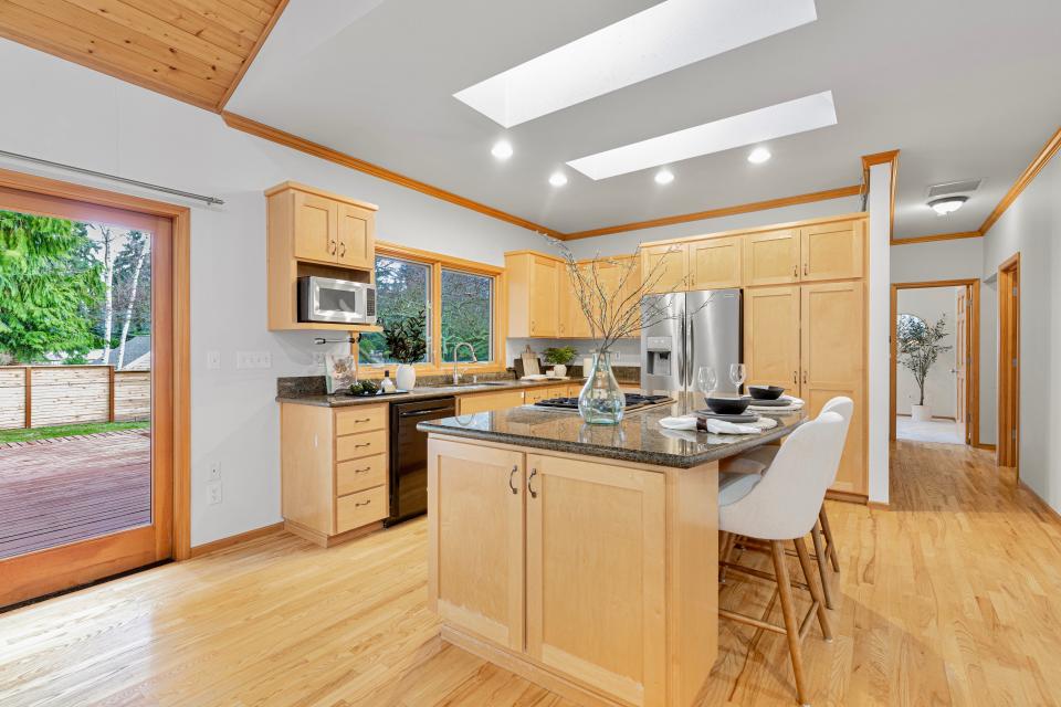 a maple and granite kitchen in the home where Jeff Bezos started Amazon