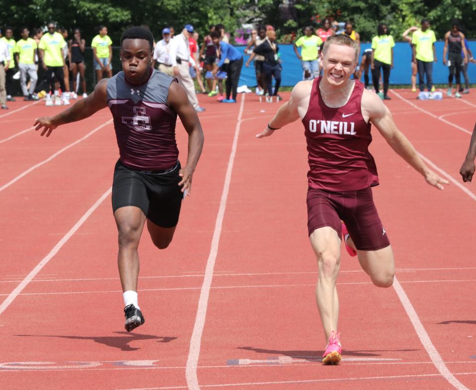 Dayzin Legare from Johnson City and Jadon Spain from James O'Neill compete in the boys 100 meter dash division 2 during the New York State Track and Field Championships at Middletown High School, June 10, 2023.