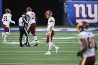 Washington Football Team quarterback Kyle Allen (8) reacts after fumbling the ball during the second half of an NFL football game against the New York Giants, Sunday, Oct. 18, 2020, in East Rutherford, N.J. The ball was recovered by the Giants and returned for a touchdown on the play. (AP Photo/John Minchillo)