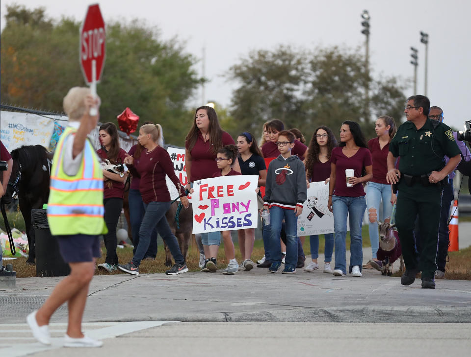 People arrive to offer support at Marjory Stoneman Douglas High School&nbsp;