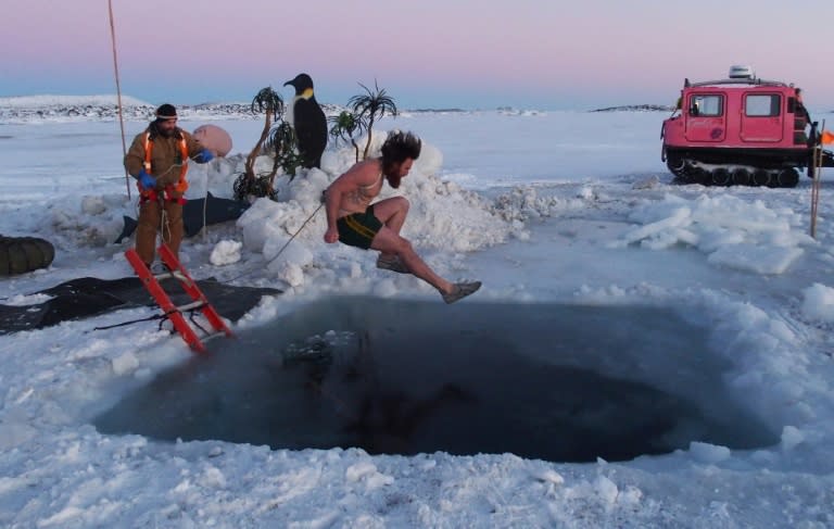 Expeditioners stationed at Australia's Davis station marked midwinter's day by taking a chainsaw to the ice, cutting a small pool and taking a dip in water with a temperature of -1.8 degrees Celsius (28.76 Fahrenheit)