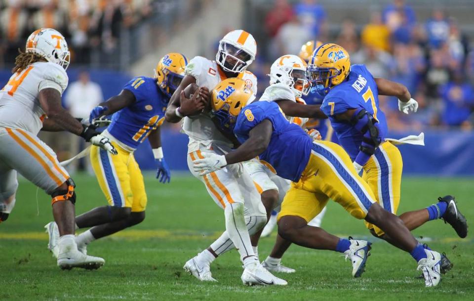 Hendon Hooker (5) of the Tennessee Volunteers gets sacked by Calijah Kancey (8) of the Pittsburgh Panthers during the second half at Acrisure Stadium in Pittsburgh, PA on Spetmebr 10, 2022. Pittsburgh Panthers Vs Tennessee Volunteers