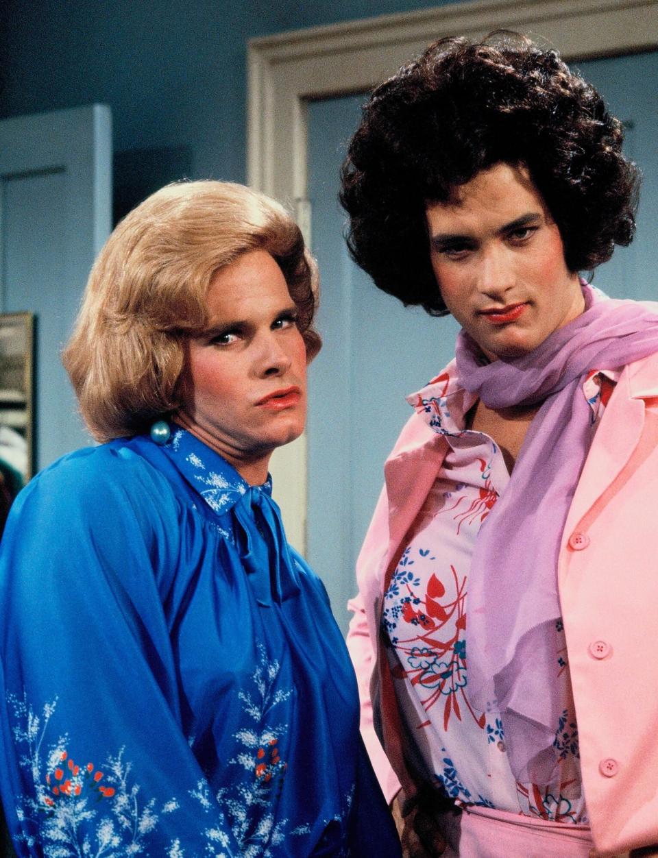 UNITED STATES - NOVEMBER 27: BOSOM BUDDIES - pilot - 11/27/80, Henry Desmond (Peter Scolari, left, in disguise as Hildegarde) and Kip Wilson (Tom Hanks, in disguise as Buffy) are young admen who solve an acute housing problem by donning wigs and dresses to qualify for residence in a hotel for women., (Photo by ABC Photo Archives/Disney General Entertainment Content via Getty Images)