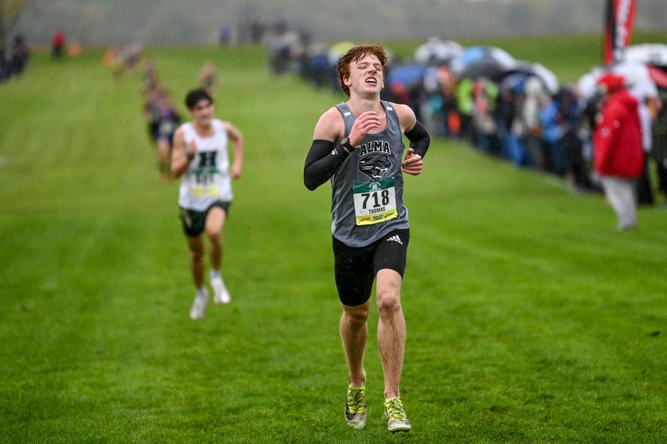 Alma's Thomas Larson comes in second place during the boys Greater Lansing Cross Country Championships on Saturday, Oct. 14, 2023, at Ledge Meadows Golf Course in Grand Ledge.
