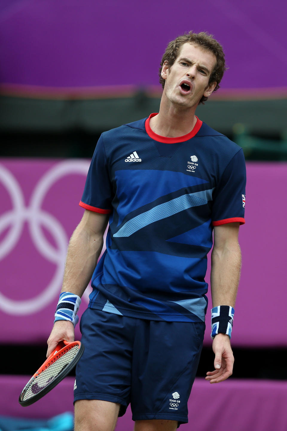 LONDON, ENGLAND - AUGUST 01: Andy Murray of Great Britain reacts in his third round Men's Singles Tennis match against Marcos Baghdatis of Cyprus on Day 5 of the London 2012 Olympic Games at Wimbledon on August 1, 2012 in London, England. (Photo by Clive Brunskill/Getty Images)