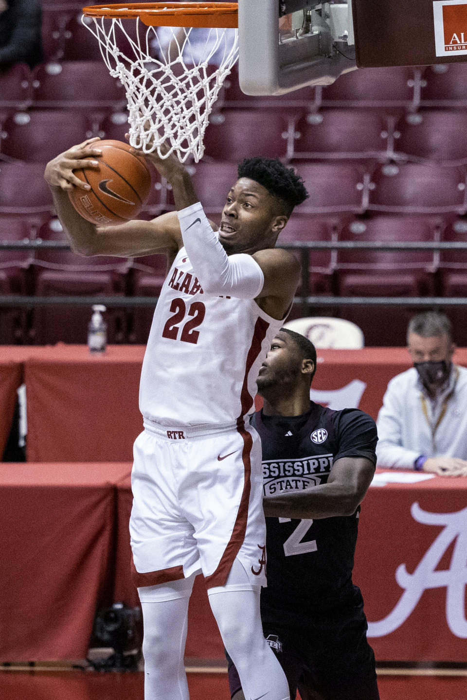 Alabama forward Keon Ambrose-Hylton (22) gets a rebound over Mississippi State forward Javian Davis (2) during the first half of an NCAA college basketball game Saturday, Jan. 23, 2021, in Tuscaloosa, Ala. (AP Photo/Vasha Hunt)