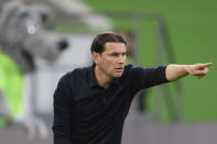 Mönchengladbach coach Gerardo Seoane gives instructions during the German Bundesliga soccer match between Borussia Monchengladbach and Wolfsburg at the Volkswagen Arena in Wolfsburg, Germany, Sunday April 7, 2024. (Swen Pförtner/dpa via AP)