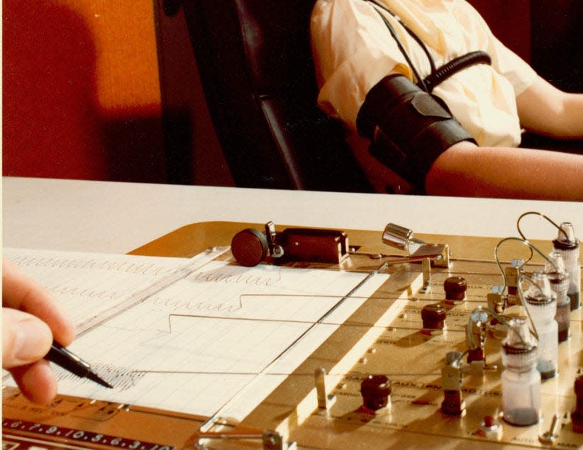 A member of the FBI conducts a polygraph test in the 1970s. Teddy Gray failed a polygraph test in the Stocking Mask Rapist case, prosecutor Ray Robertson said.