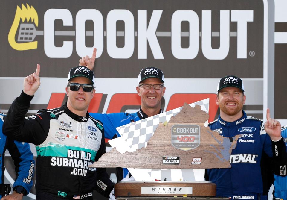 Brad Keselowski (left) celebrates with Chris Buescher (right) and Buescher's crew chief Scott Graves (center) in Victory Lane on Sunday after Buescher drove the RFK Racing No. 17 to Victory Lane.