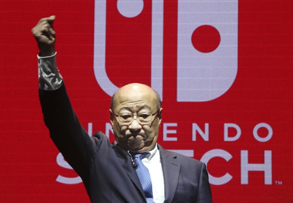 President of Nintendo Tatsumi Kimishima reacts after his speech during a presentation event of Nintendo Switch in Tokyo, Friday, Jan. 13, 2017. Nintendo Co. said Friday that its Nintendo Switch video game console will sell for 29,980 yen (about $260) in Japan, starting March 3. (AP Photo/Koji Sasahara)