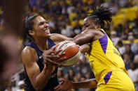 Connecticut Sun's Alyssa Thomas, left, is fouled by Los Angeles Sparks' Nneka Ogwumike during the first half of Game 3 of a WNBA basketball playoff game Sunday, Sept. 22, 2019, in Long Beach, Calf. (AP Photo/Ringo H.W. Chiu)