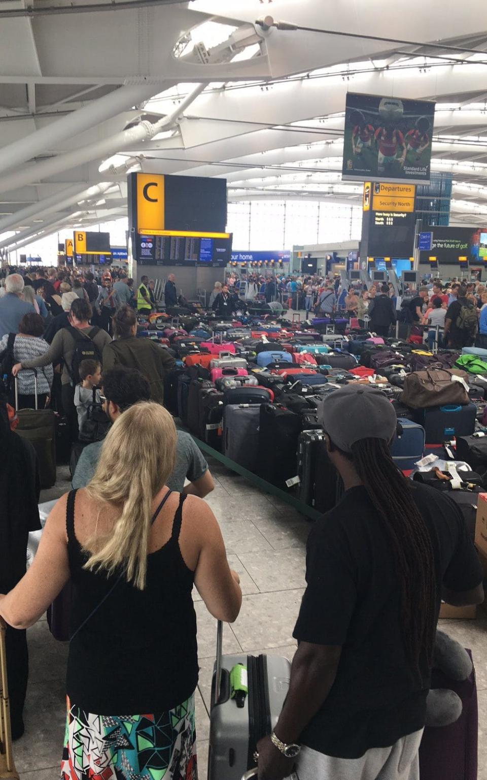 Photo taken by Cheryl Sullivan of queues at British Airways check in desks at Heathrow Airport - Credit: Twitter