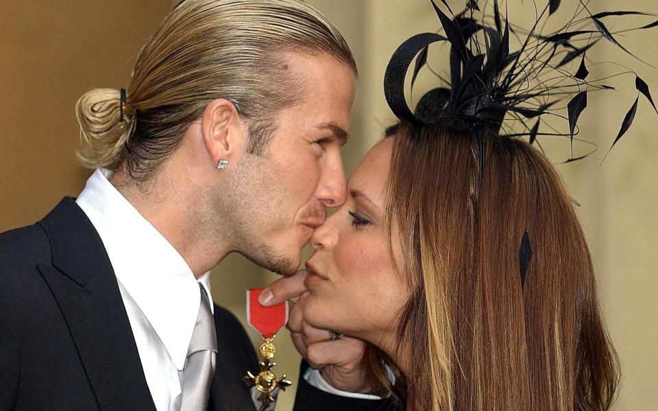 David and Victoria in 2003, after he received his OBE