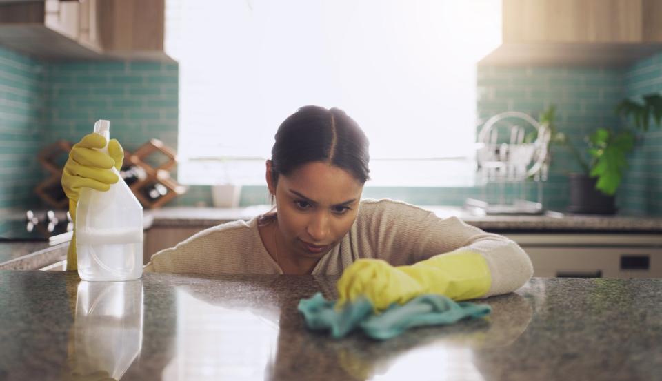 how to seal granite woman looking at counter