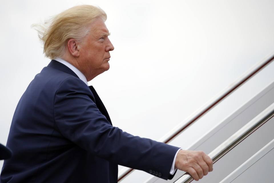 President Donald Trump boards Air Force One, Wednesday, July 17, 2019, in Andrews Air Force Base, Md., en route to a campaign rally in Greenville, N.C. (AP Photo/Carolyn Kaster)