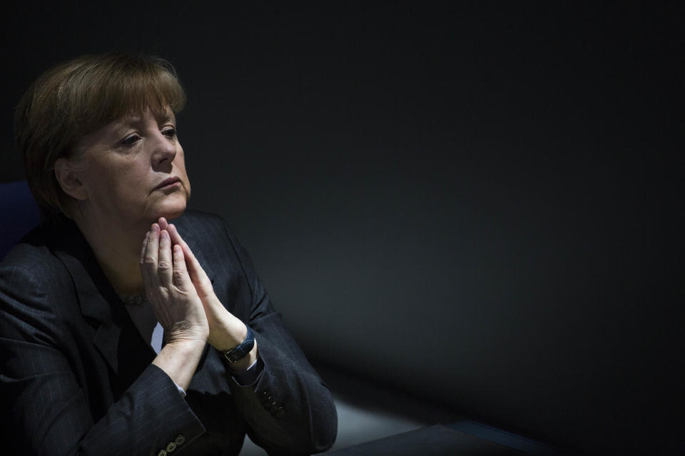 German Chancellor Angela Merkel listens to the debate about the Ukrainian crisis at the parliament Bundestag in Berlin, Thursday, March 13, 2014. German Chancellor Angela Merkel warned Moscow on Thursday that if it continues its current course in the Ukraine crisis, Russia risks “massive” political and economic consequences. In an address to Parliament, Merkel told lawmakers the only way out of the crisis is through diplomacy and assured lawmakers that “the use of the military is no option.” (AP Photo/Markus Schreiber)