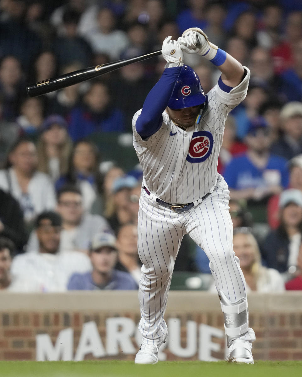 Chicago Cubs' Seiya Suzuki backs away from ball four from Pittsburgh Pirates relief pitcher Yohan Ramirez to load the bases during the sixth inning of a baseball game Wednesday, June 14, 2023, in Chicago. (AP Photo/Charles Rex Arbogast)