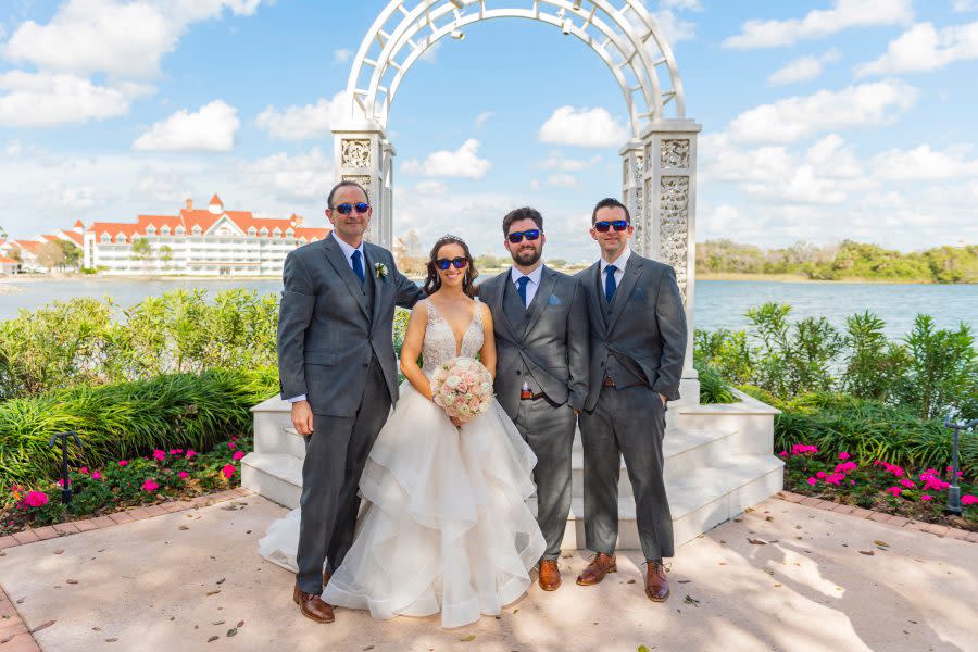 Bride Kristin Robinson, who is colorblind, sees the world in color for the first time as she celebrates her dream wedding alongside her groom and family at Disney’s Wedding Pavilion on January 25, 2023 at Walt Disney World Resort in Lake Buena Vista, Fla. (Abigail Nilsson, photographer)