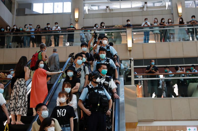 Riot police patrol at a shopping mall during a protest after China's parliament passes a national security law for Hong Kong, in Hong Kong