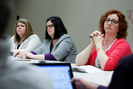 Public Health Educator and Opioid Overdose Prevention Coordinator at the Broome County Health Department Marissa Lamphere, Broome County Director of Public Health Rebecca Kaufman and Drug Free Communities Coordinator Maria Fabrizi chair a meeting of the Broome Opioid Awareness Council and Drug Free Communities group the Broome County Health Department in Binghamton, New York, U.S., April 6, 2018. REUTERS/Andrew Kelly