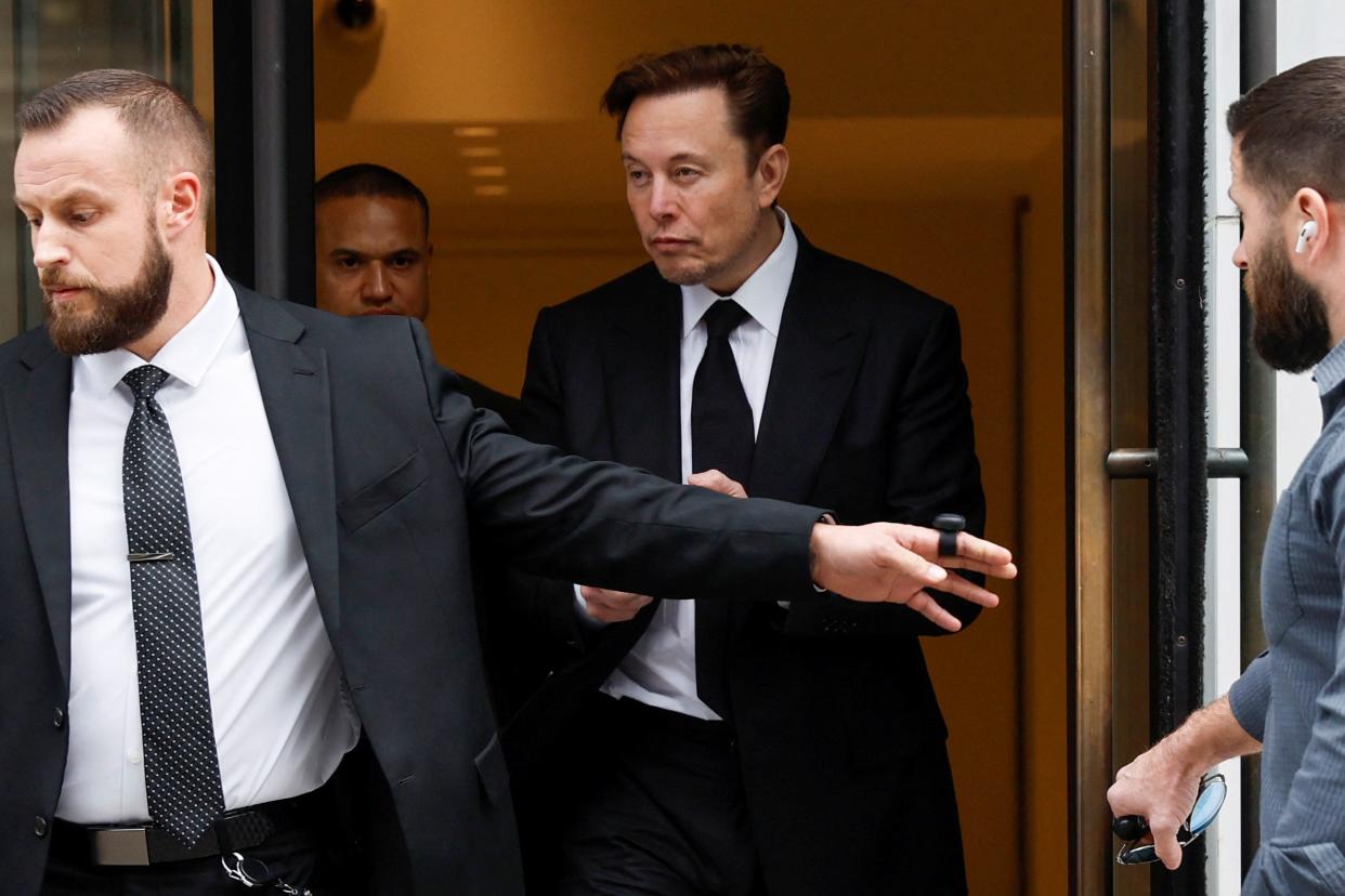Elon Musk leaves Tesla's Washington office on January 27.
