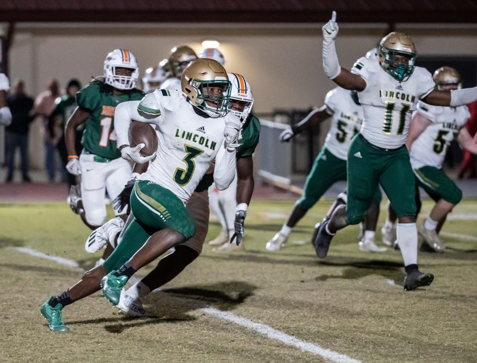 Raylen Wilson heads for the end zone with a score for Lincoln in the second half. Mosley and Lincoln battled in the Region 1-6A semifinals at Tommy Oliver Stadium Friday, November 19, 2021. The Dolphins came away with the win 31-28.