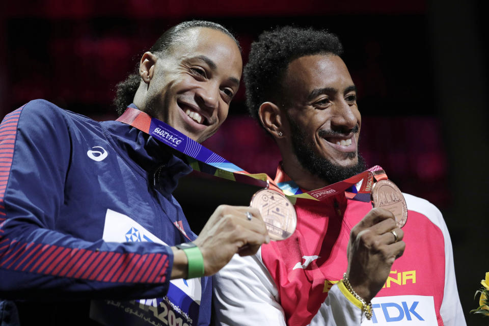 Joint bronze medalists Orlando Ortega, of Spain, right, and Pascal Martinot-Lagarde, of France, during the award ceremony for the men's 110 meter hurdles at the World Athletics Championships in Doha, Qatar, Thursday, Oct. 3, 2019. (AP Photo/Nariman El-Mofty)