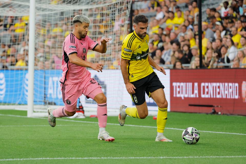 Aug 13, 2024; Columbus, Ohio, USA; Columbus Crew defender Rudy Camacho (4) dribbles chased by Inter Miami defender Marcelo Weigandt (57) first half at Lower.com. Mandatory Credit: Rick Osentoski-USA TODAY Sports